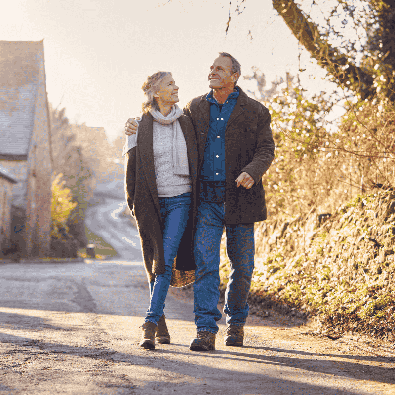 Mature couple walking through a village